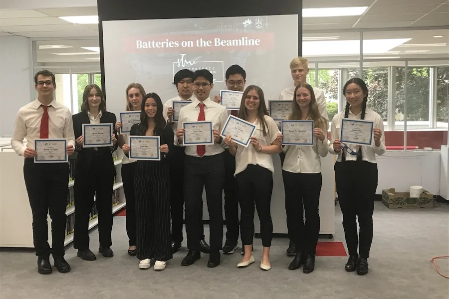 Student researchers holding certificates, photo by Joe Muise